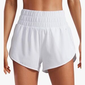 CRZ YOGA High Waisted Dolphin Running Shorts with Mesh Liner and Zipper Pocket